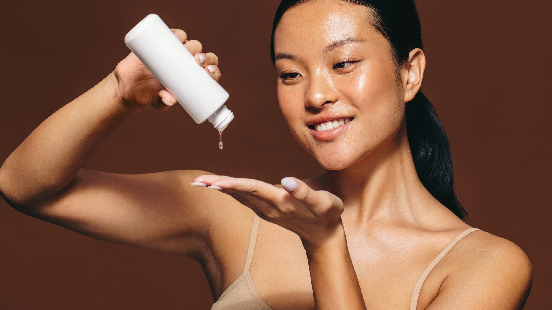 A woman applying skincare A woman applying skincare